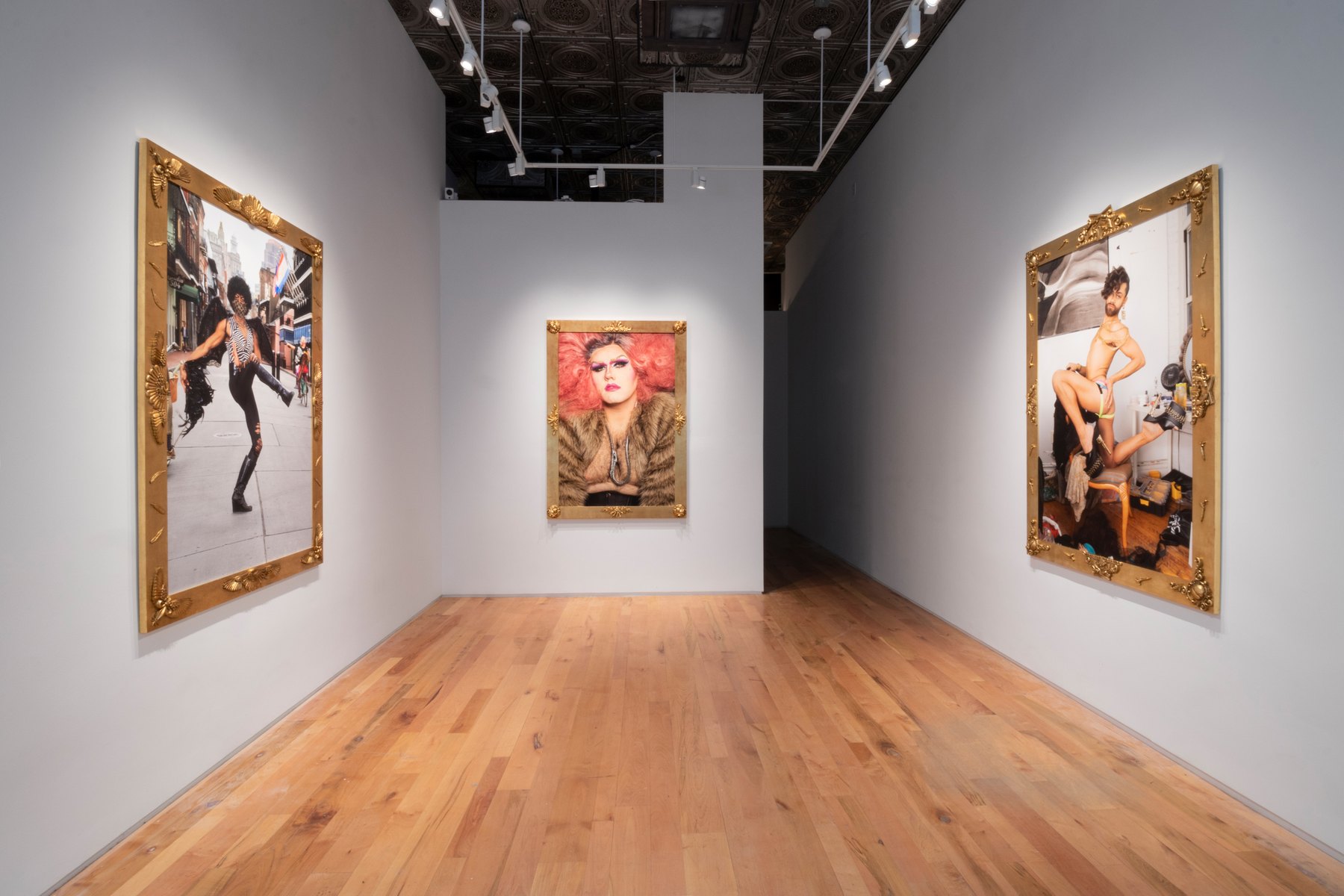 Best Lives portraits installed at Denny Dimin Gallery